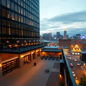 Exterior and rooftop bar of a luxury downtown Nashville hotel with city skyline at dusk