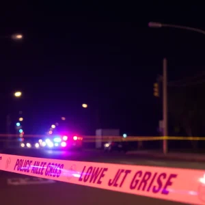 Police presence at a convenience store parking lot after a shooting incident