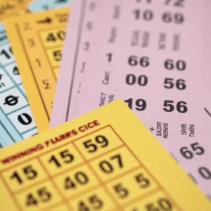 Lottery tickets with winning numbers featured prominently