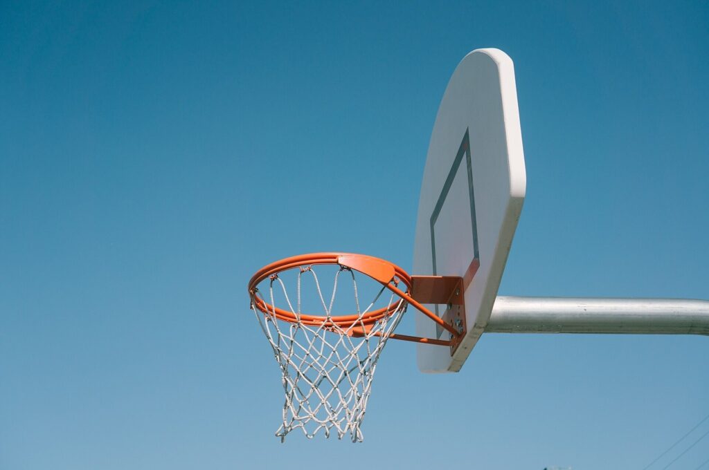 Basketball hoop and net against a clear sky
