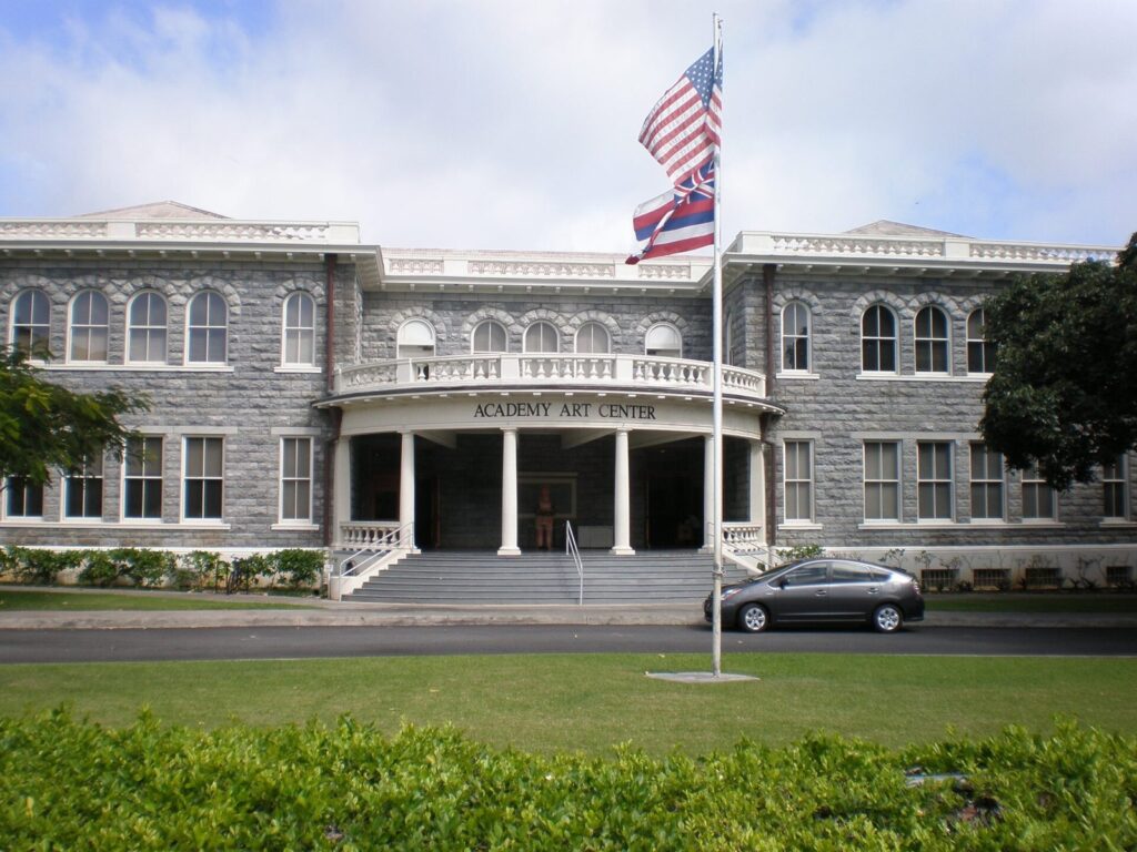 Flag flying in front of a historic building