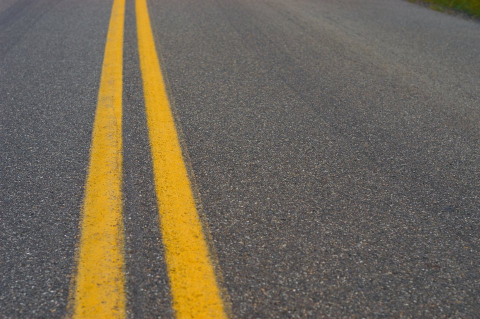 Double yellow center lines on asphalt